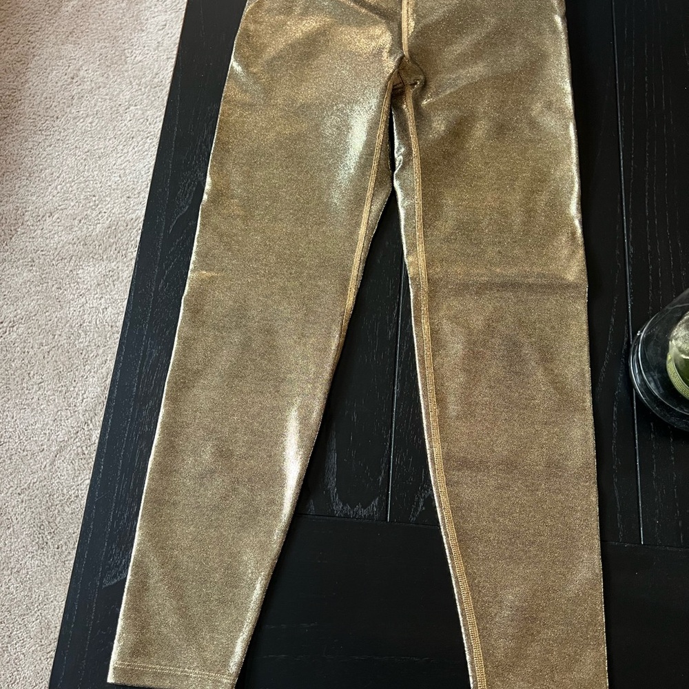 Used 1 time unique Gold Leggings. Heroine sport brand.